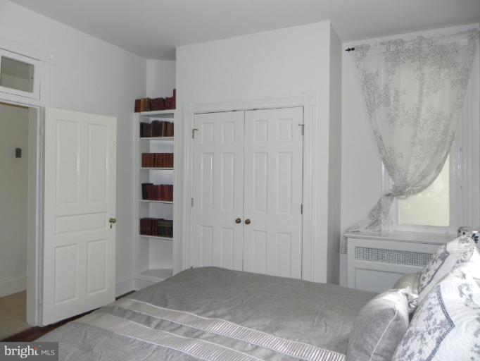 401 Hawthorn Road Baltimore, MD 21210 - Photo 4 of 26 a view of a livingroom with wooden floor and closet