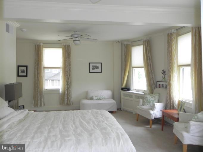 401 Hawthorn Road Baltimore, MD 21210 - Photo 7 of 26 a spacious bedroom with a bed and a window