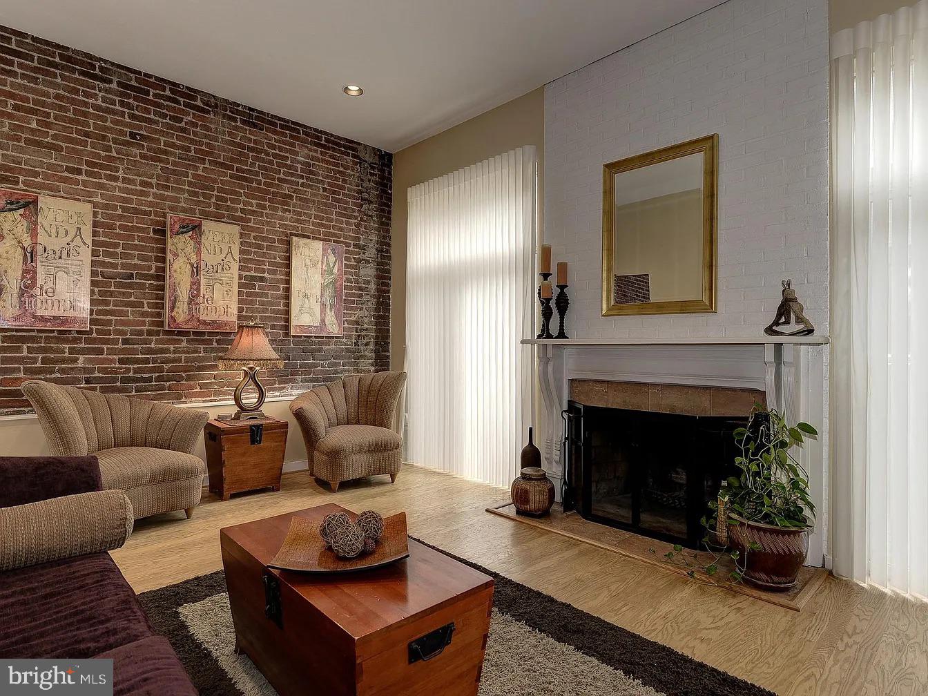 825 F Street Northeast Washington, DC 20002 - Photo 15 of 31 a living room with furniture and a fireplace