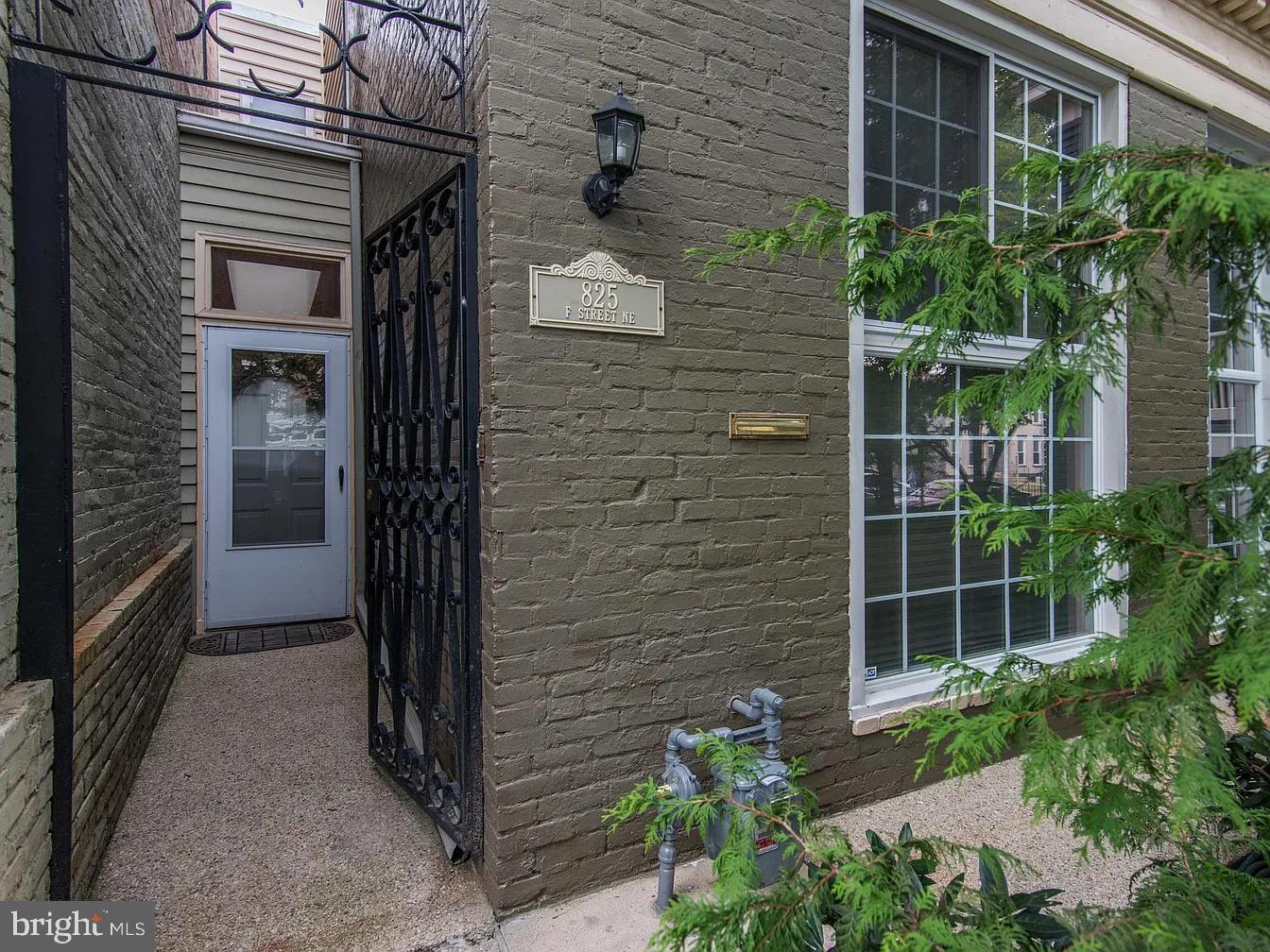 825 F Street Northeast Washington, DC 20002 - Photo 2 of 31 a view of a door of the house and trees