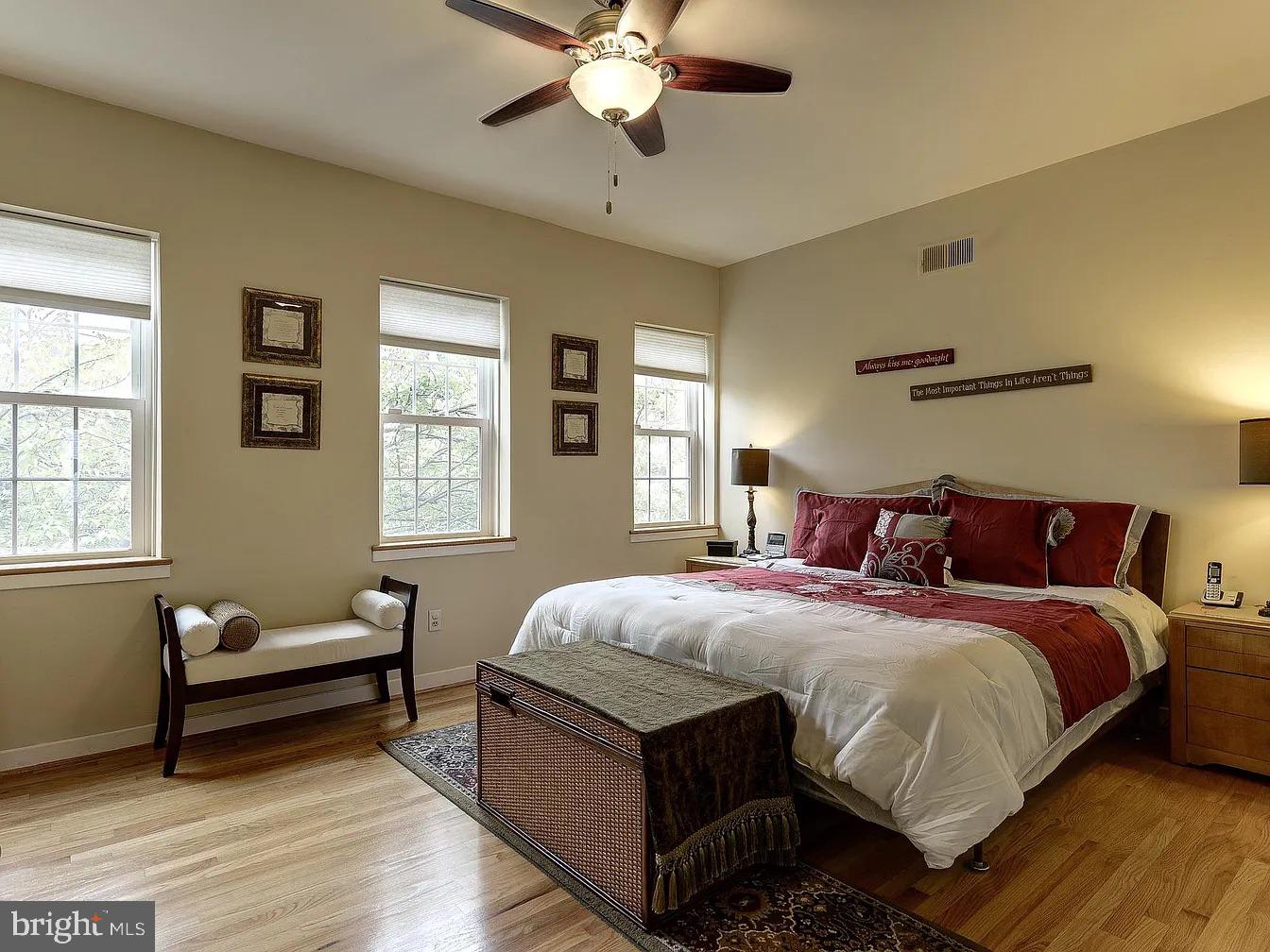 825 F Street Northeast Washington, DC 20002 - Photo 21 of 31 a bedroom with a bed and wooden floor