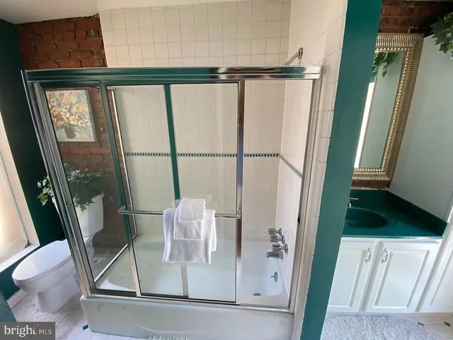 a view of walk in closet with furniture and window