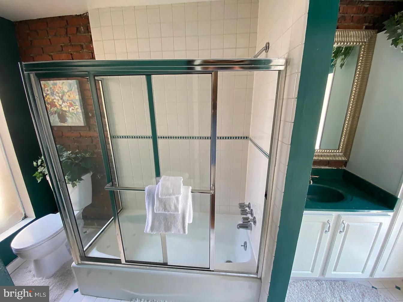 825 F Street Northeast Washington, DC 20002 - Photo 22 of 31 a view of walk in closet with furniture and window