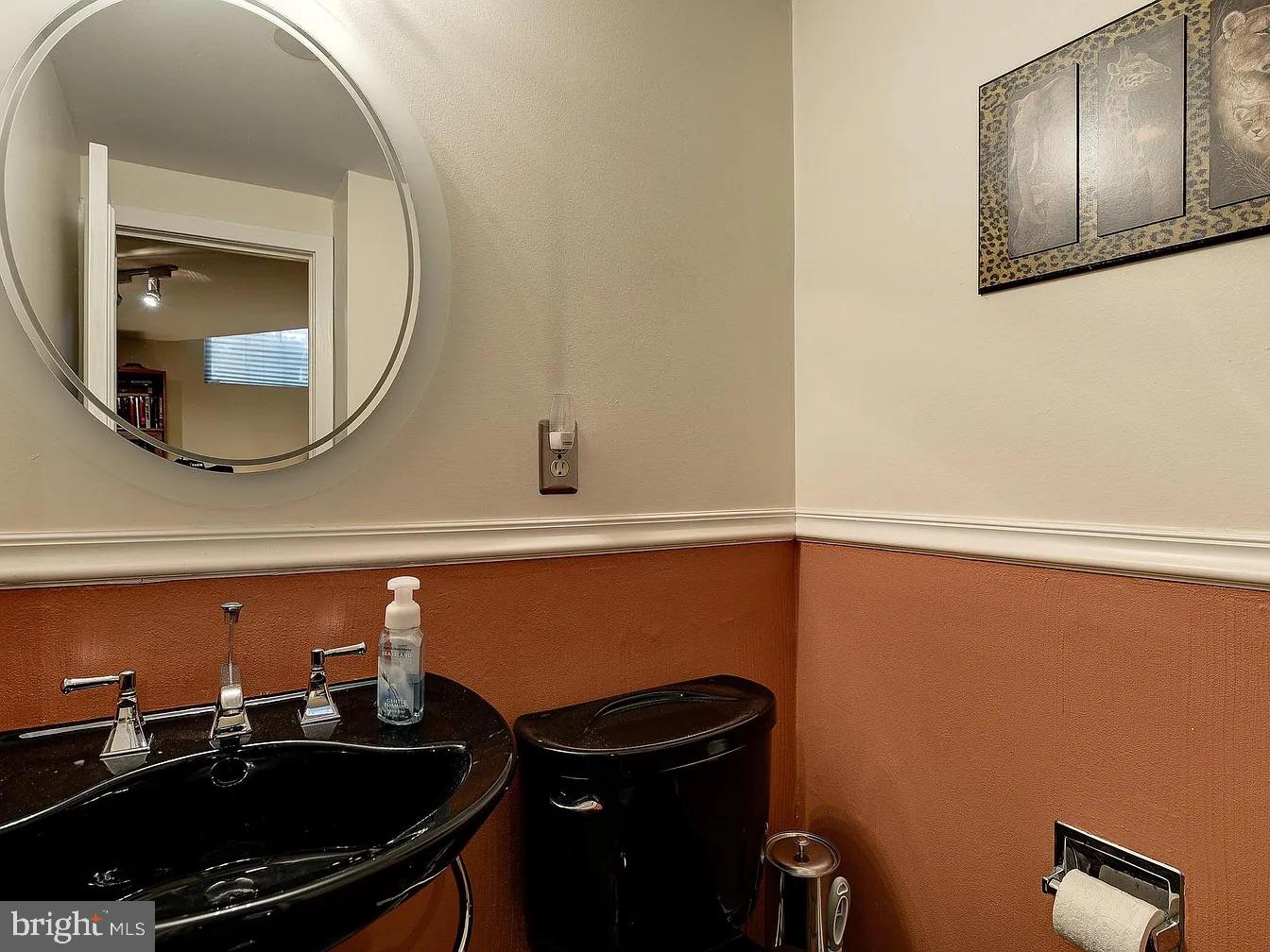 825 F Street Northeast Washington, DC 20002 - Photo 23 of 31 a bathroom with a sink and a mirror