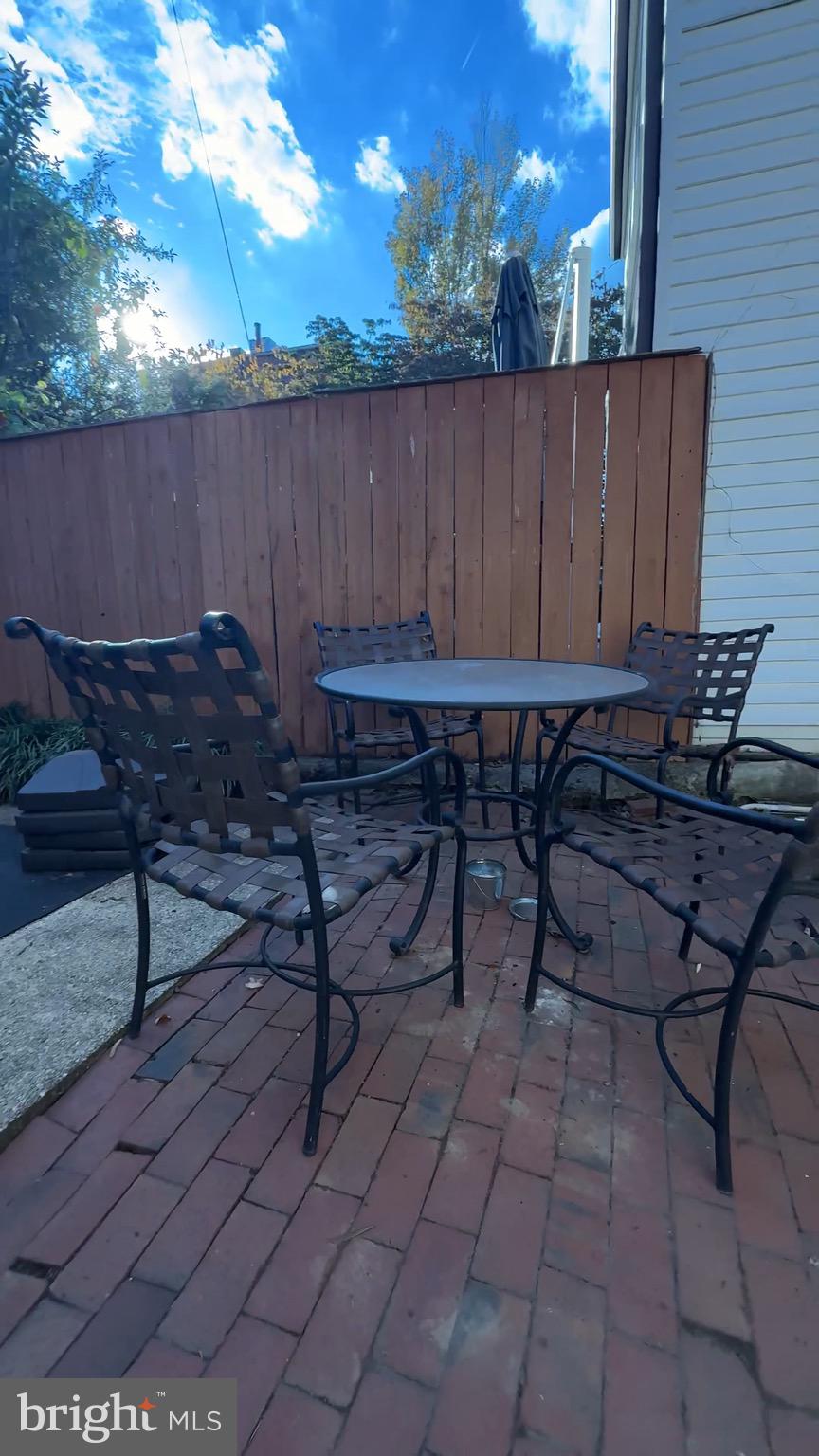 825 F Street Northeast Washington, DC 20002 - Photo 27 of 31 a view of a chairs and table in a backyard