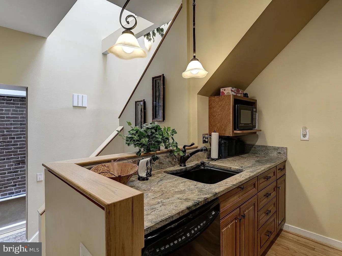 825 F Street Northeast Washington, DC 20002 - Photo 7 of 31 a bathroom with a sink and a mirror
