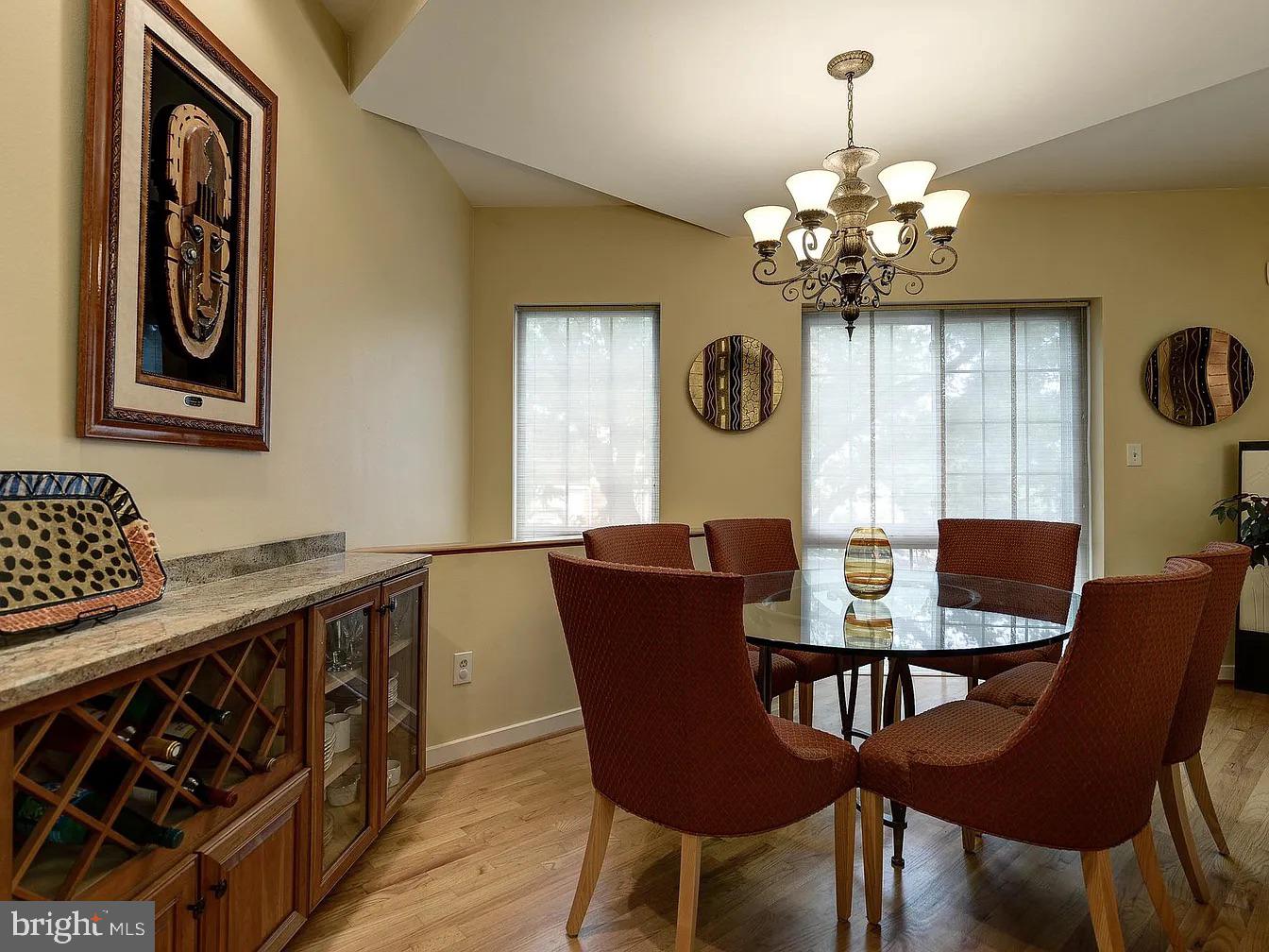 825 F Street Northeast Washington, DC 20002 - Photo 9 of 31 a view of a dining room with furniture a chandelier and wooden floor
