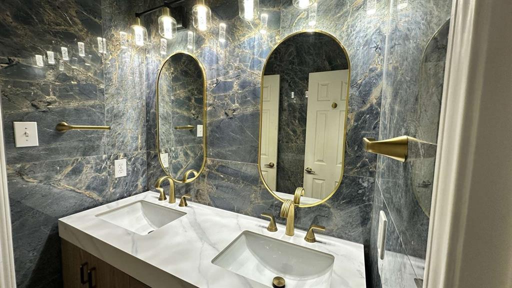 5713 Allen Lane Rowlett, TX 75088 - Photo 17 of 20 a bathroom with a sink and a mirror