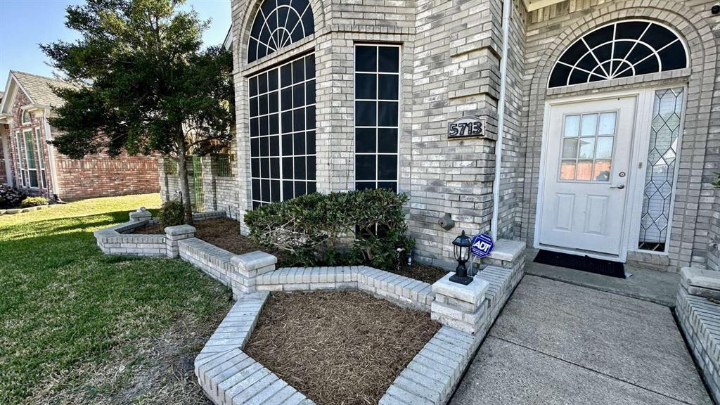 5713 Allen Lane Rowlett, TX 75088 - Photo 2 of 20 a front view of a house with a yard