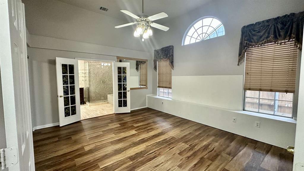 5713 Allen Lane Rowlett, TX 75088 - Photo 10 of 20 wooden floor in an empty room with a window