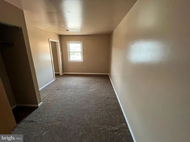 a bathroom with a granite countertop toilet and a shower