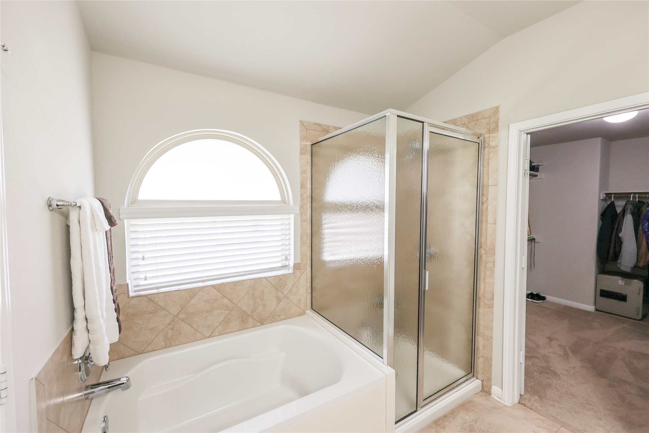 717 Schefer Street Leander, TX 78641 - Photo 13 of 27 a bathroom with a bathtub and a shower