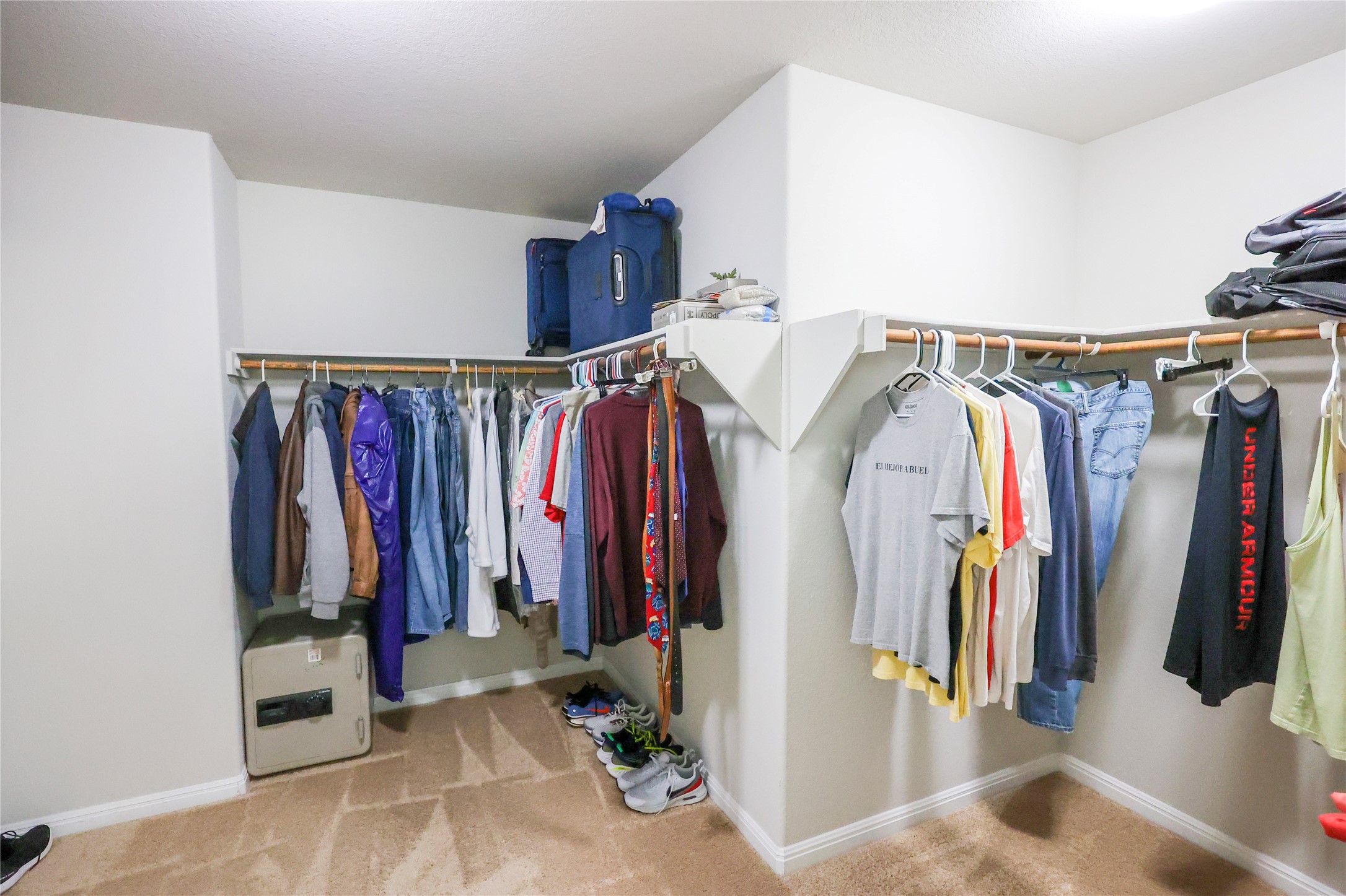 717 Schefer Street Leander, TX 78641 - Photo 16 of 27 a view of walk in closet with clothes