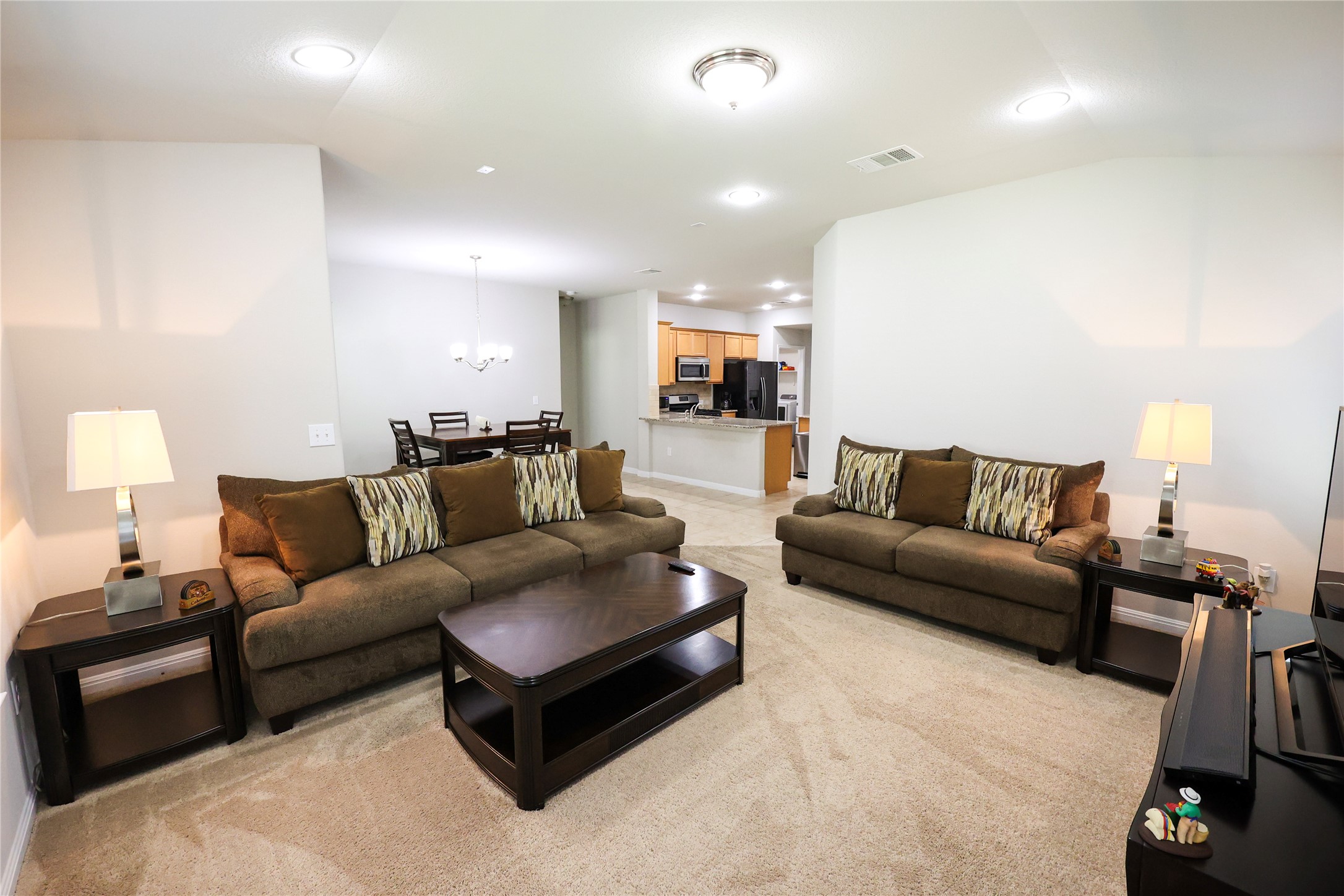 717 Schefer Street Leander, TX 78641 - Photo 2 of 27 a living room with furniture and wooden floor