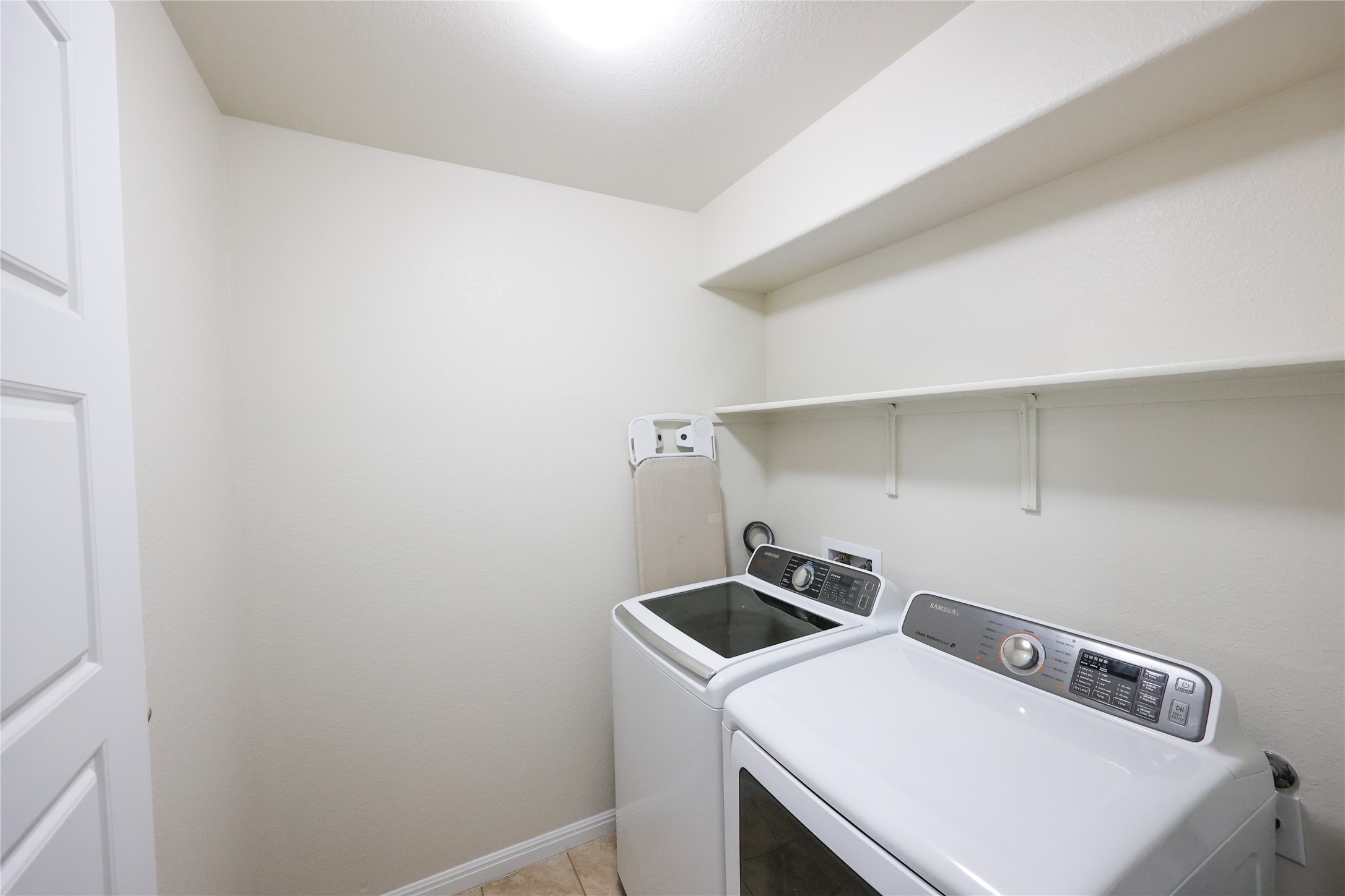 717 Schefer Street Leander, TX 78641 - Photo 21 of 27 a utility room with dryer and washer