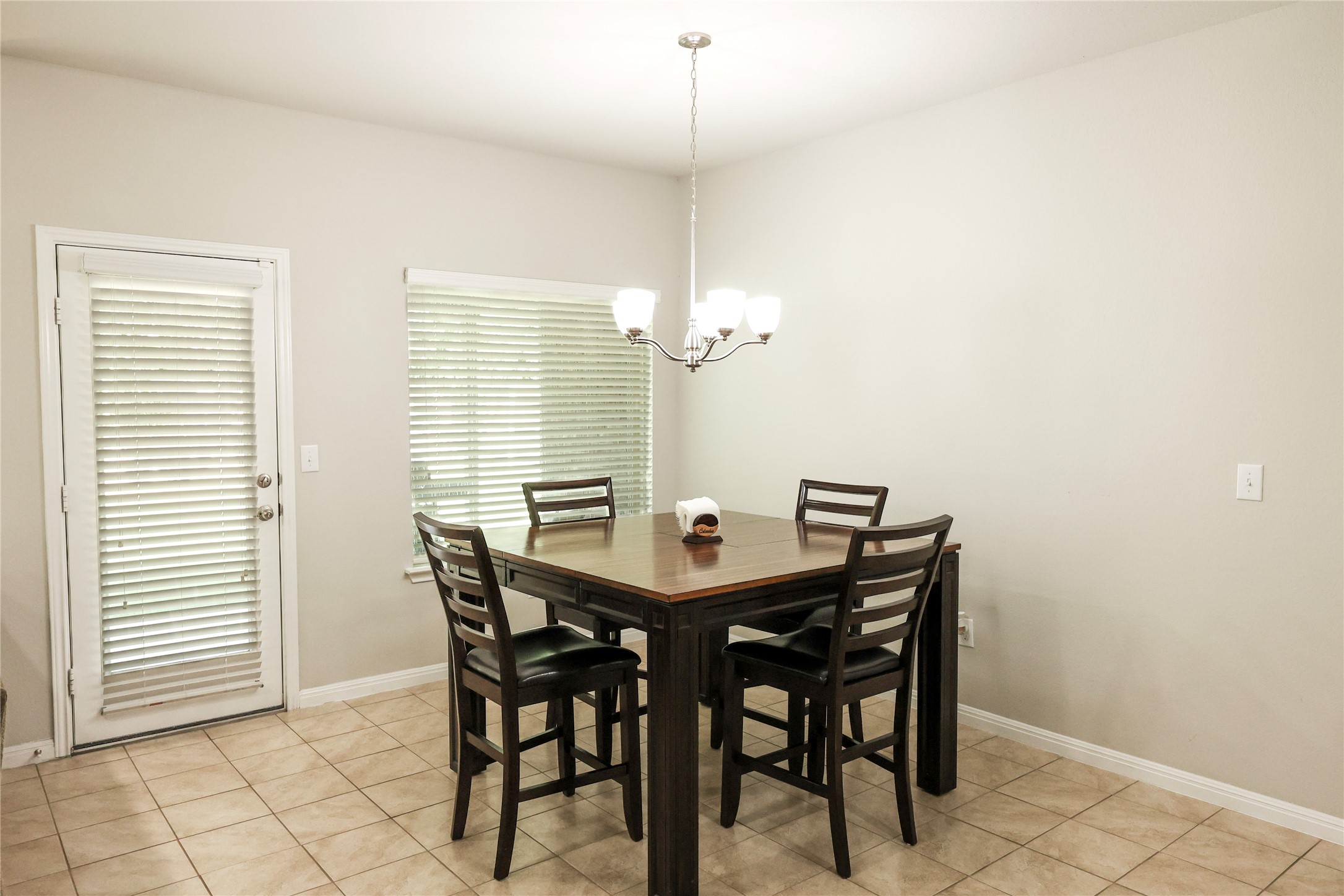 717 Schefer Street Leander, TX 78641 - Photo 5 of 27 a view of a dining room with furniture and window
