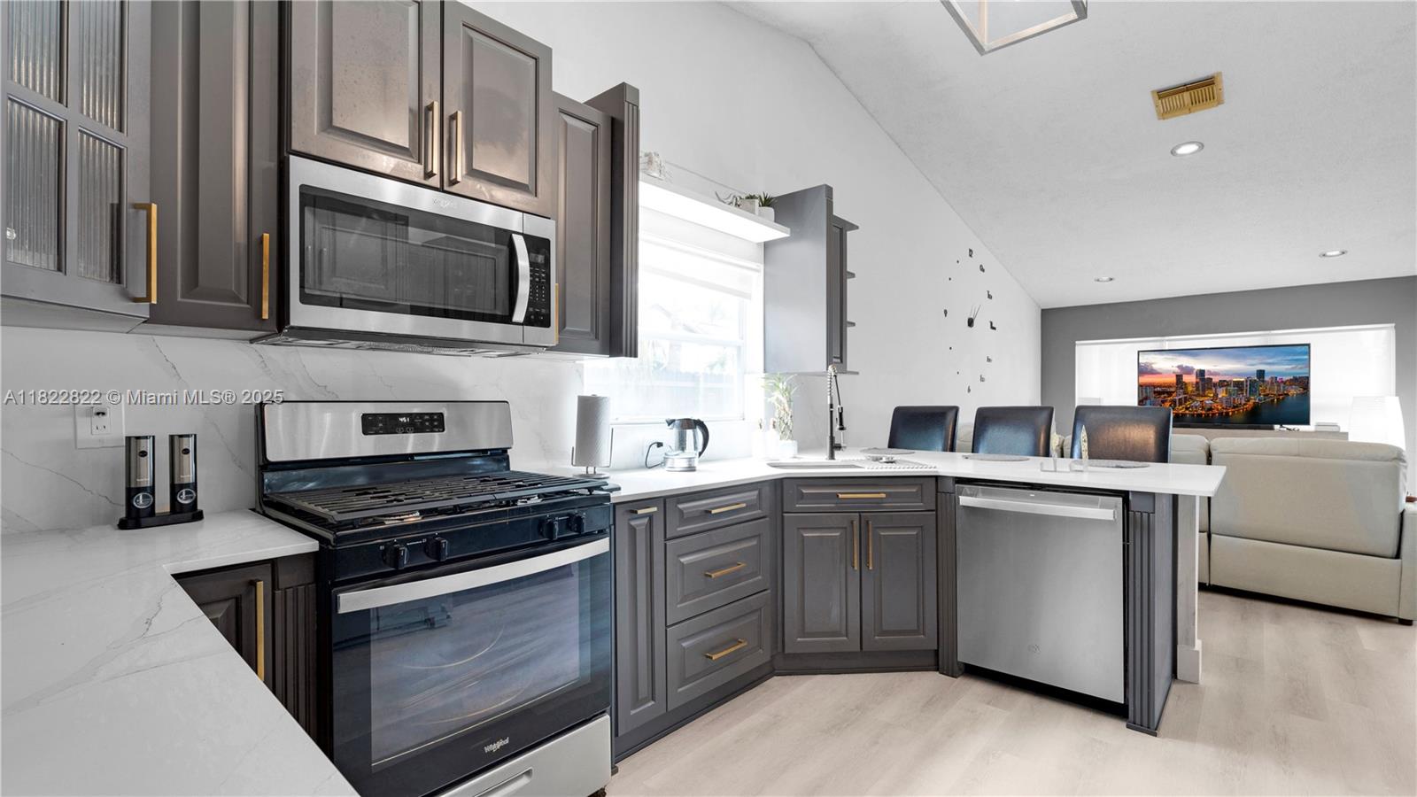 8356 Southwest 158th Avenue Miami, FL 33193 - Photo 13 of 48 a kitchen with cabinets stainless steel appliances and a sink