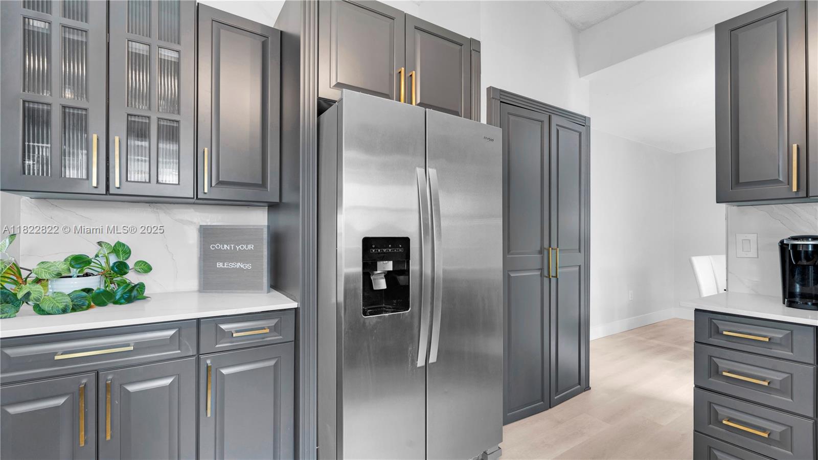 8356 Southwest 158th Avenue Miami, FL 33193 - Photo 14 of 48 a kitchen with stainless steel appliances granite countertop a refrigerator and a sink