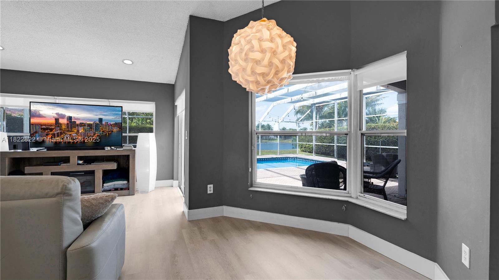 8356 Southwest 158th Avenue Miami, FL 33193 - Photo 20 of 48 a living room with fireplace furniture and a flat screen tv