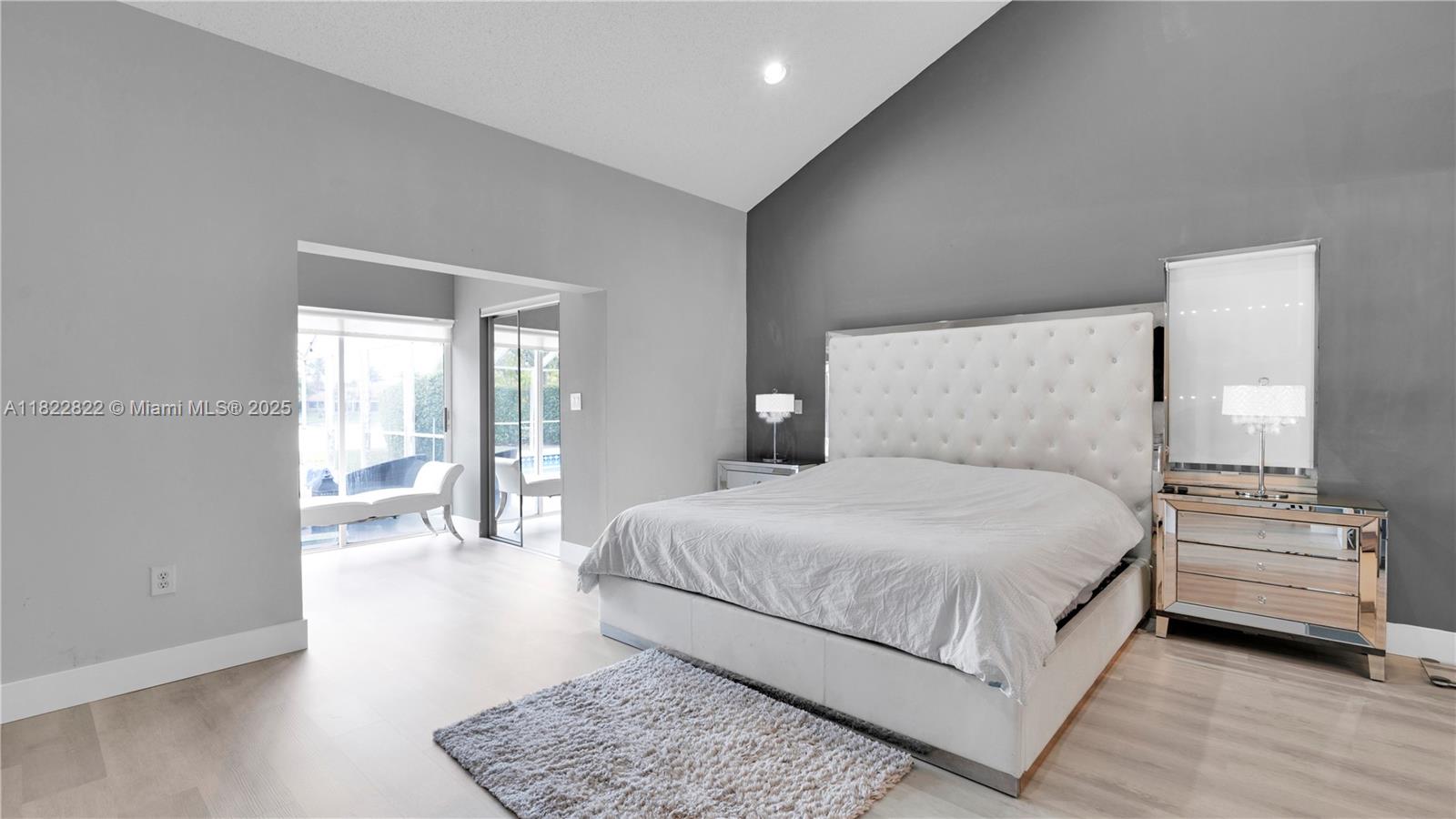 8356 Southwest 158th Avenue Miami, FL 33193 - Photo 21 of 48 a bedroom with a bed a table and chairs