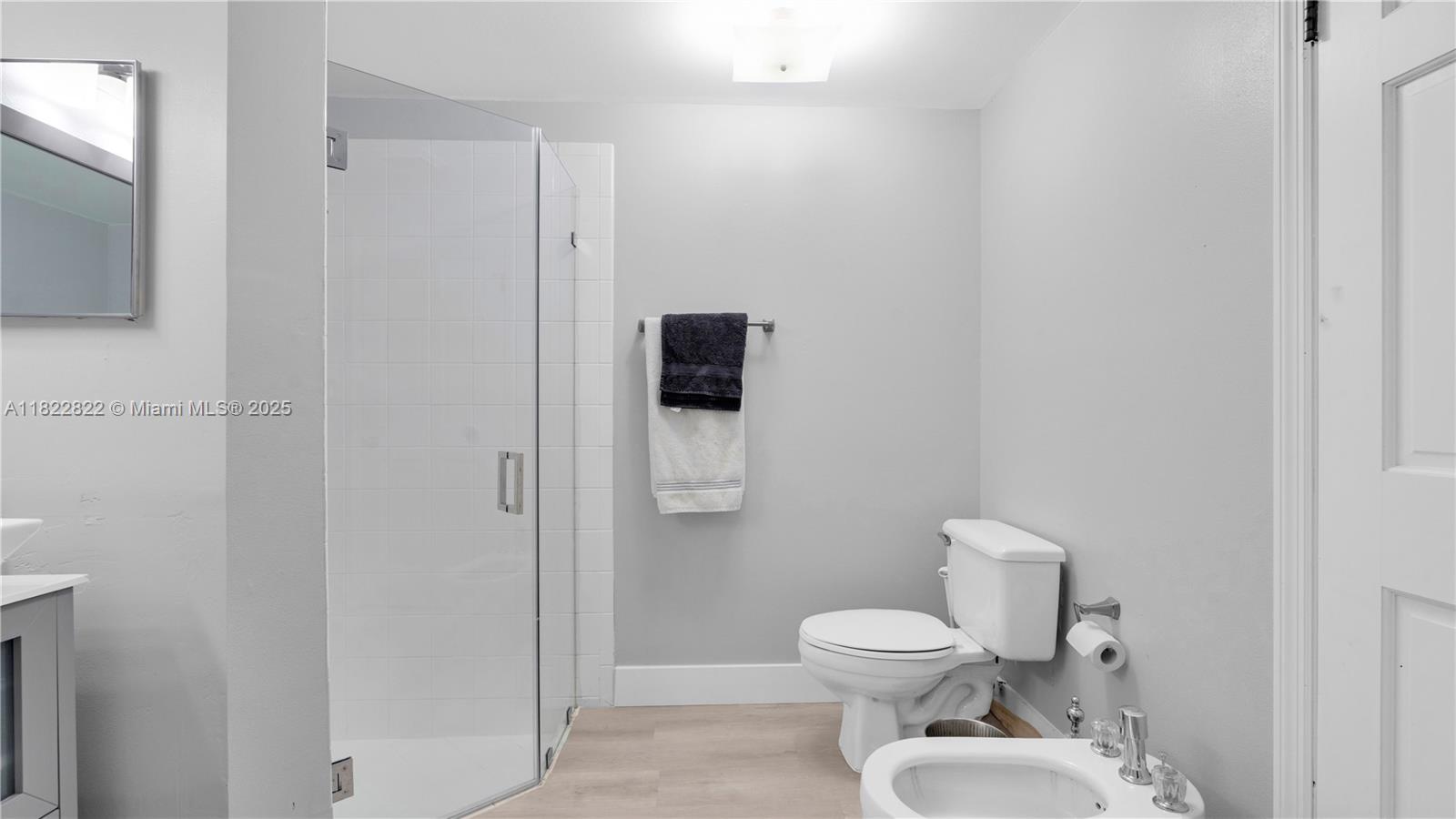 8356 Southwest 158th Avenue Miami, FL 33193 - Photo 26 of 48 a white toilet sitting next to a bathroom sink