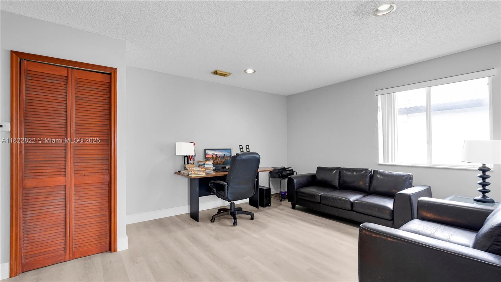 8356 Southwest 158th Avenue Miami, FL 33193 - Photo 28 of 48 a living room with furniture and a window