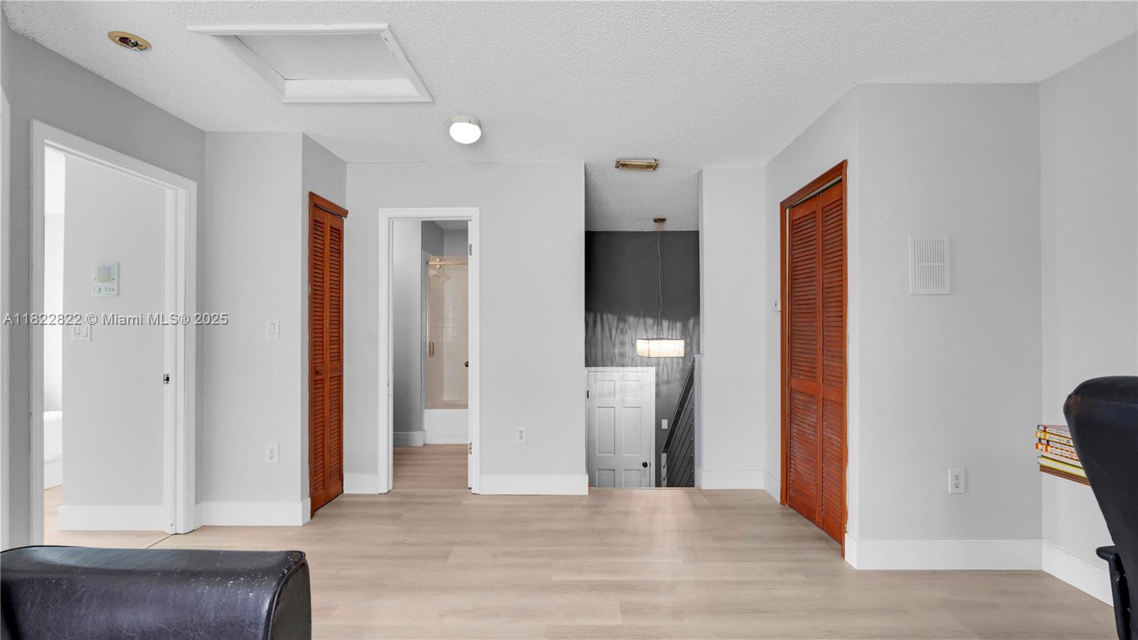 8356 Southwest 158th Avenue Miami, FL 33193 - Photo 29 of 48 a view of a hallway with wooden floor and entryway