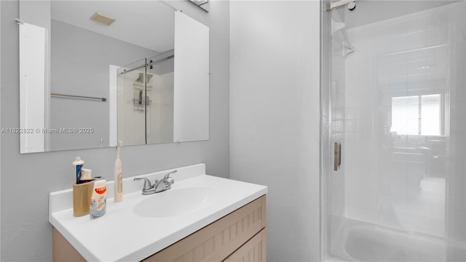 8356 Southwest 158th Avenue Miami, FL 33193 - Photo 30 of 48 a bathroom with a sink and a shower