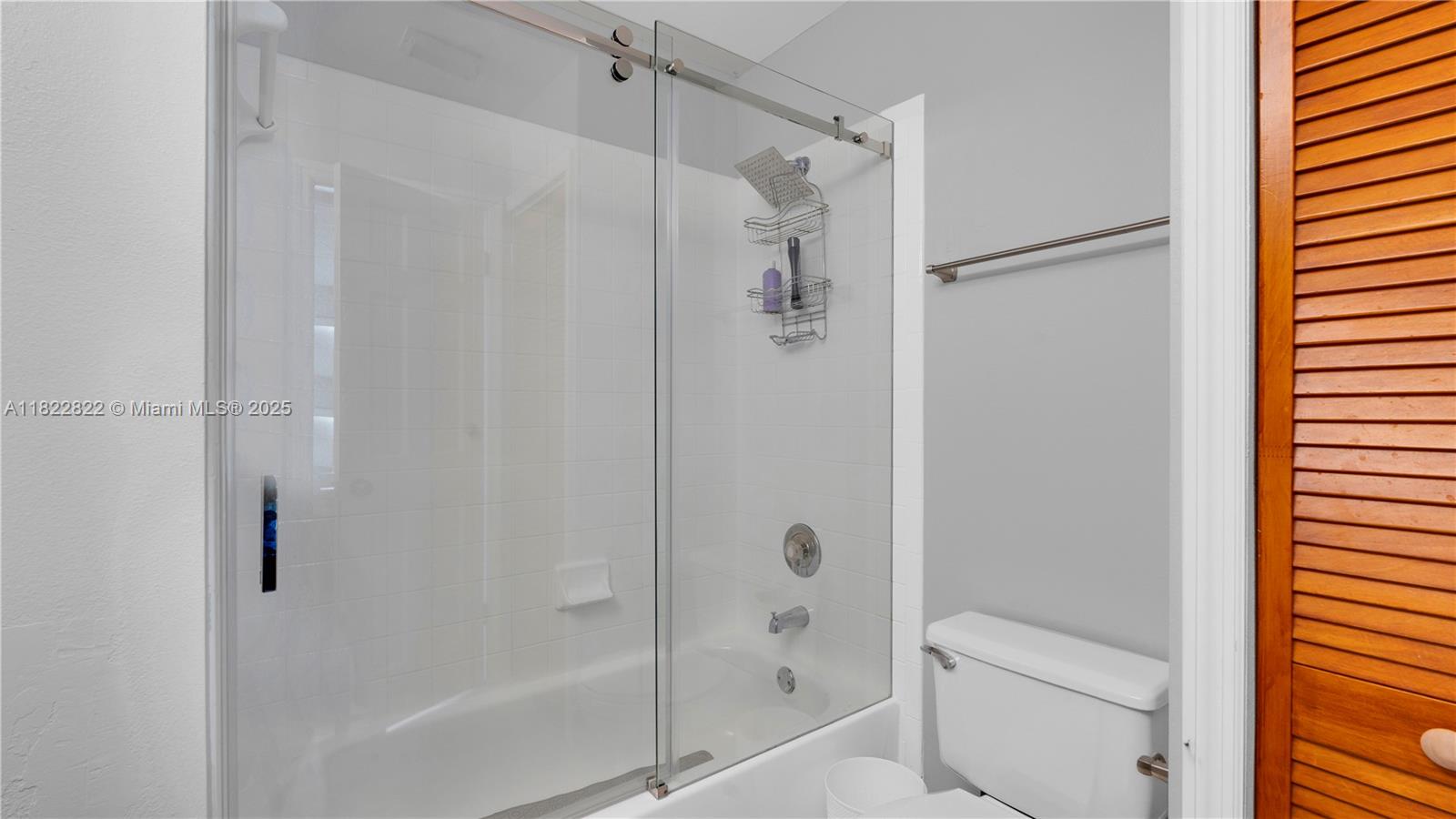 8356 Southwest 158th Avenue Miami, FL 33193 - Photo 31 of 48 a bathroom with a shower and a toilet