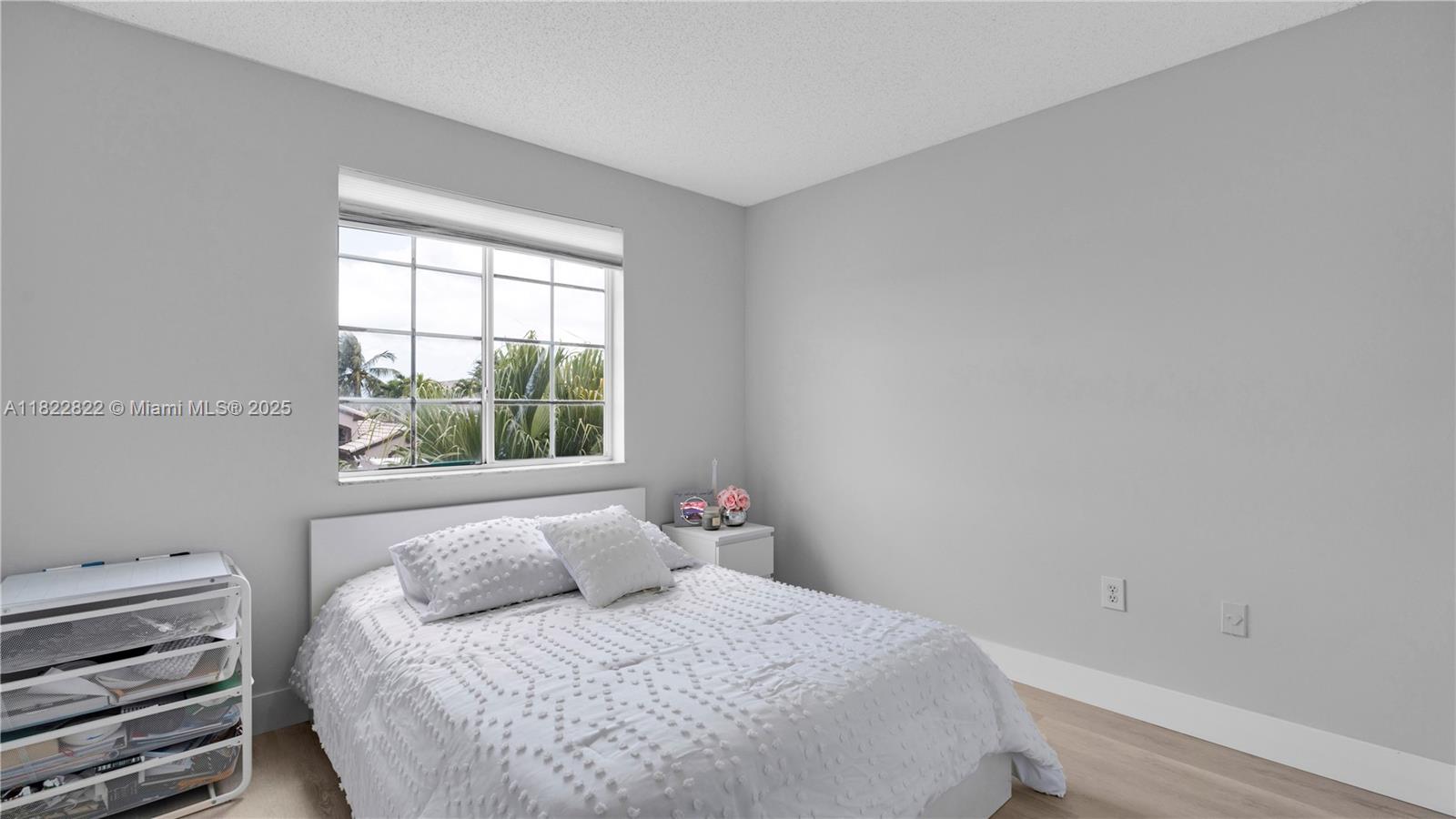 8356 Southwest 158th Avenue Miami, FL 33193 - Photo 32 of 48 a bedroom with a bed and a window
