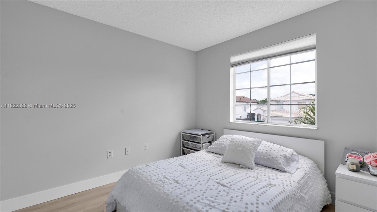 8356 Southwest 158th Avenue Miami, FL 33193 - Photo 33 of 48 a bedroom with a bed and a window