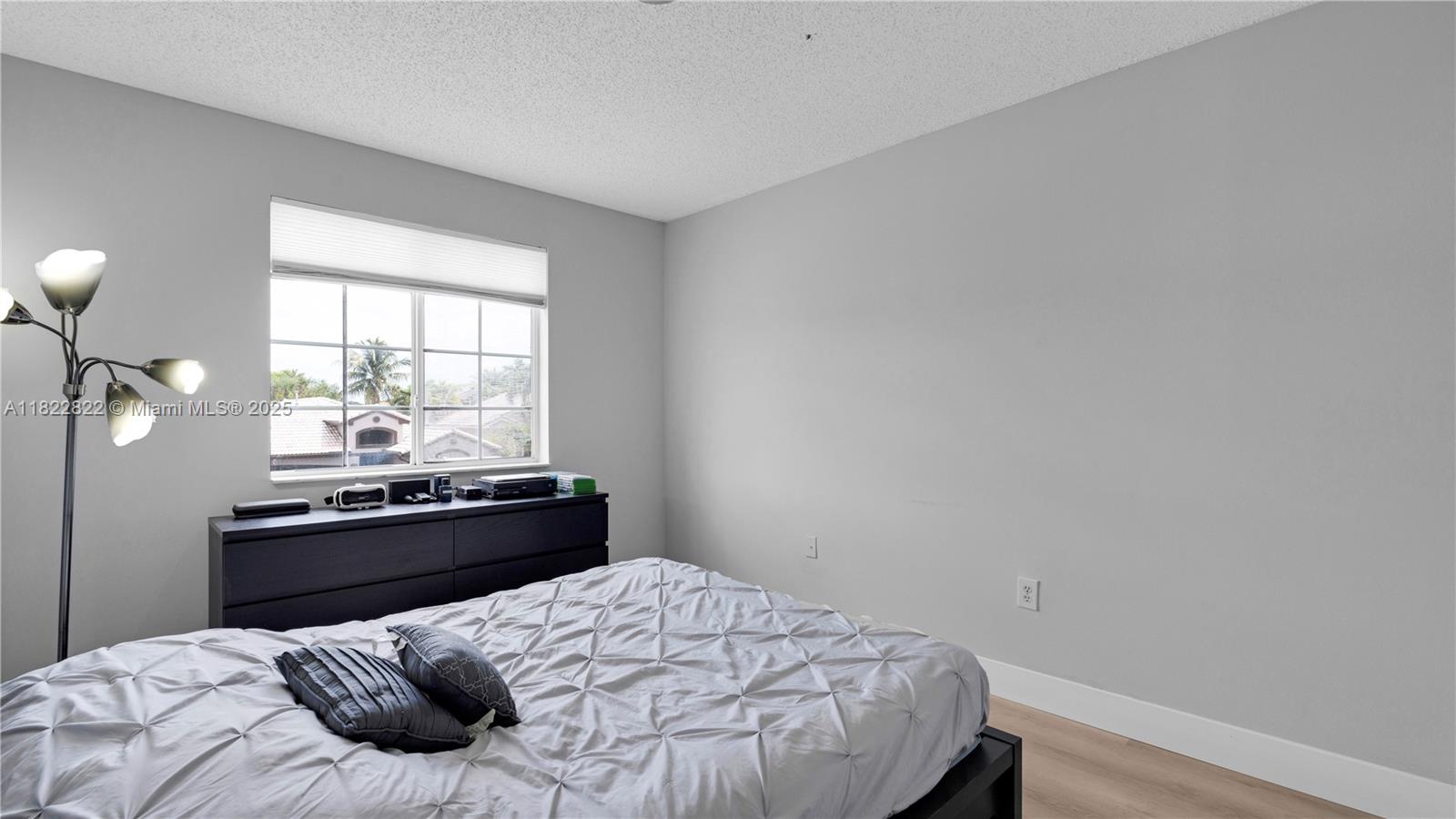 8356 Southwest 158th Avenue Miami, FL 33193 - Photo 35 of 48 a bedroom with a bed and window