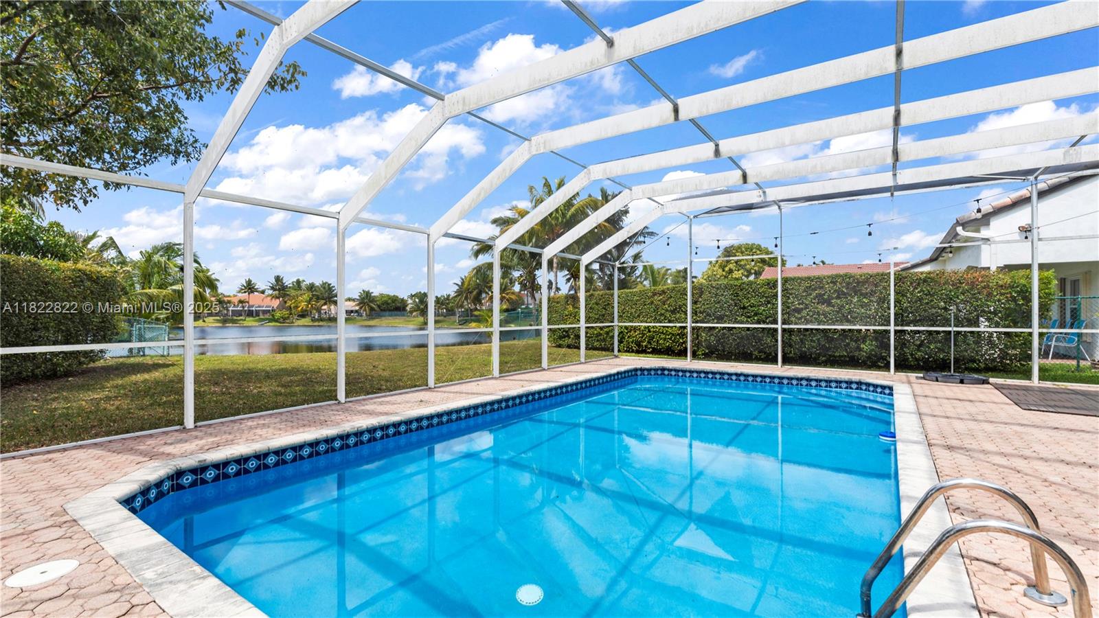 8356 Southwest 158th Avenue Miami, FL 33193 - Photo 38 of 48 a view of a swimming pool with a sink and yard next to a window