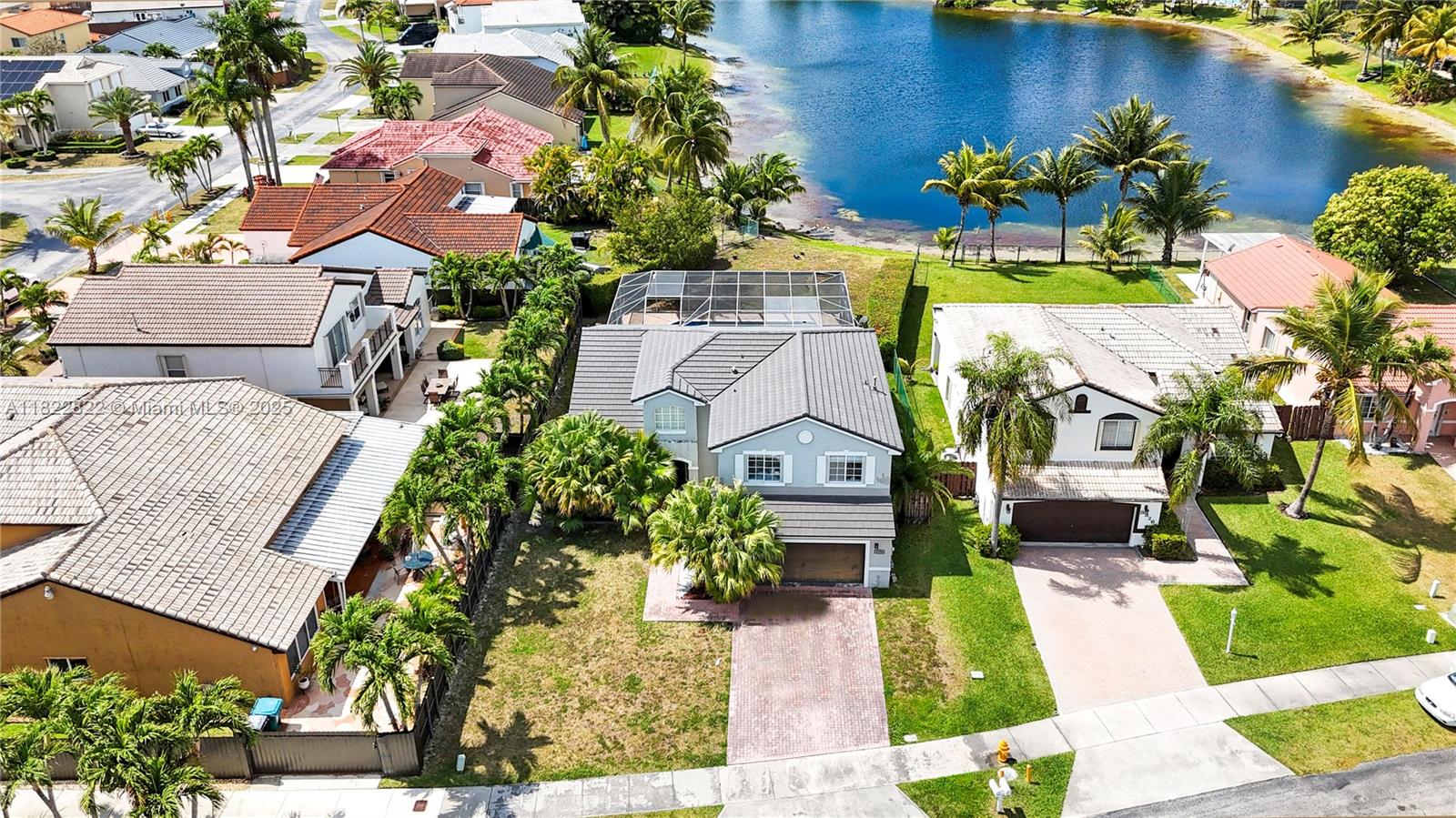 8356 Southwest 158th Avenue Miami, FL 33193 - Photo 4 of 48 an aerial view of a house with a yard basket ball court and outdoor seating