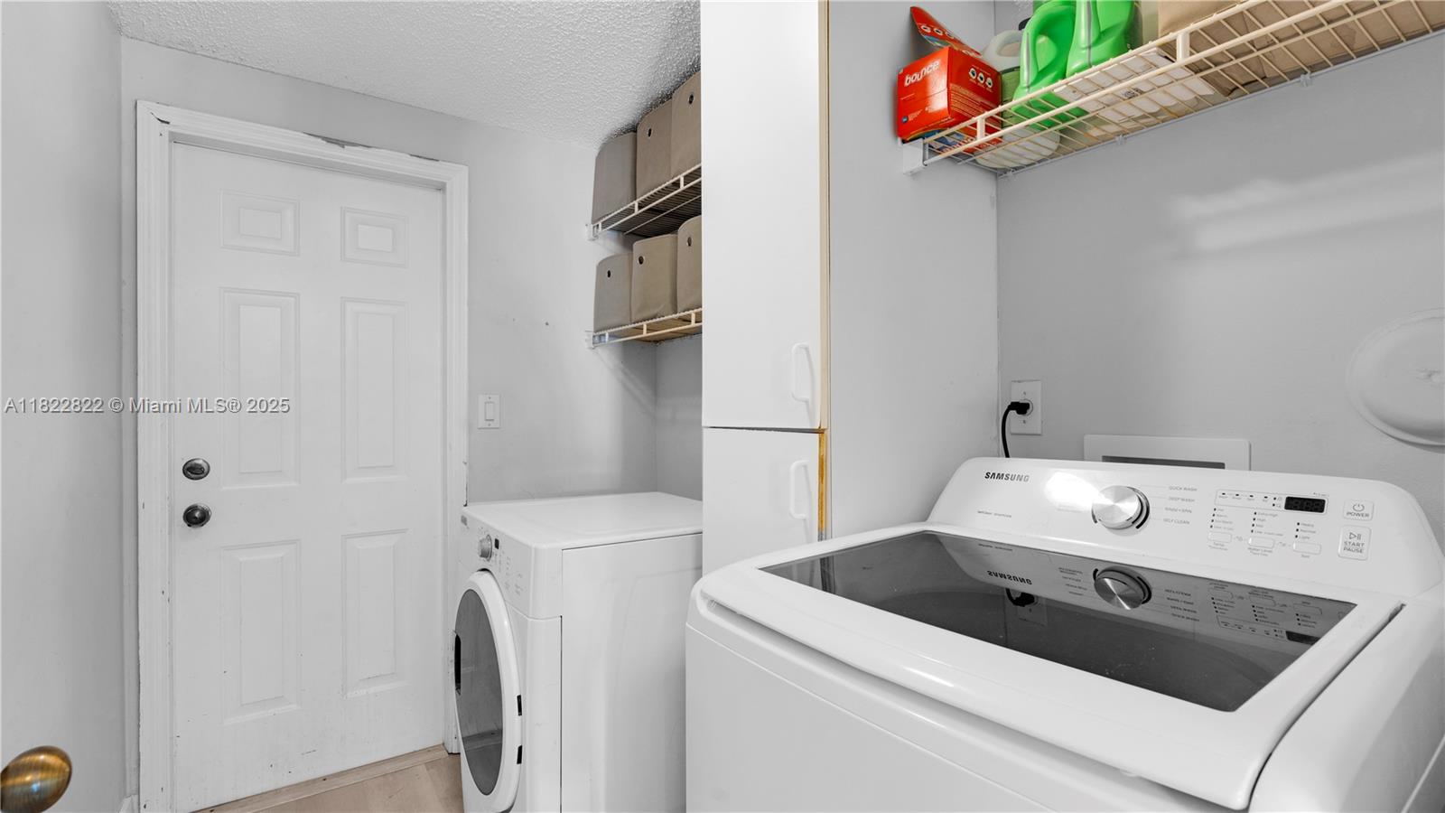 8356 Southwest 158th Avenue Miami, FL 33193 - Photo 41 of 48 a utility room with dryer and washer