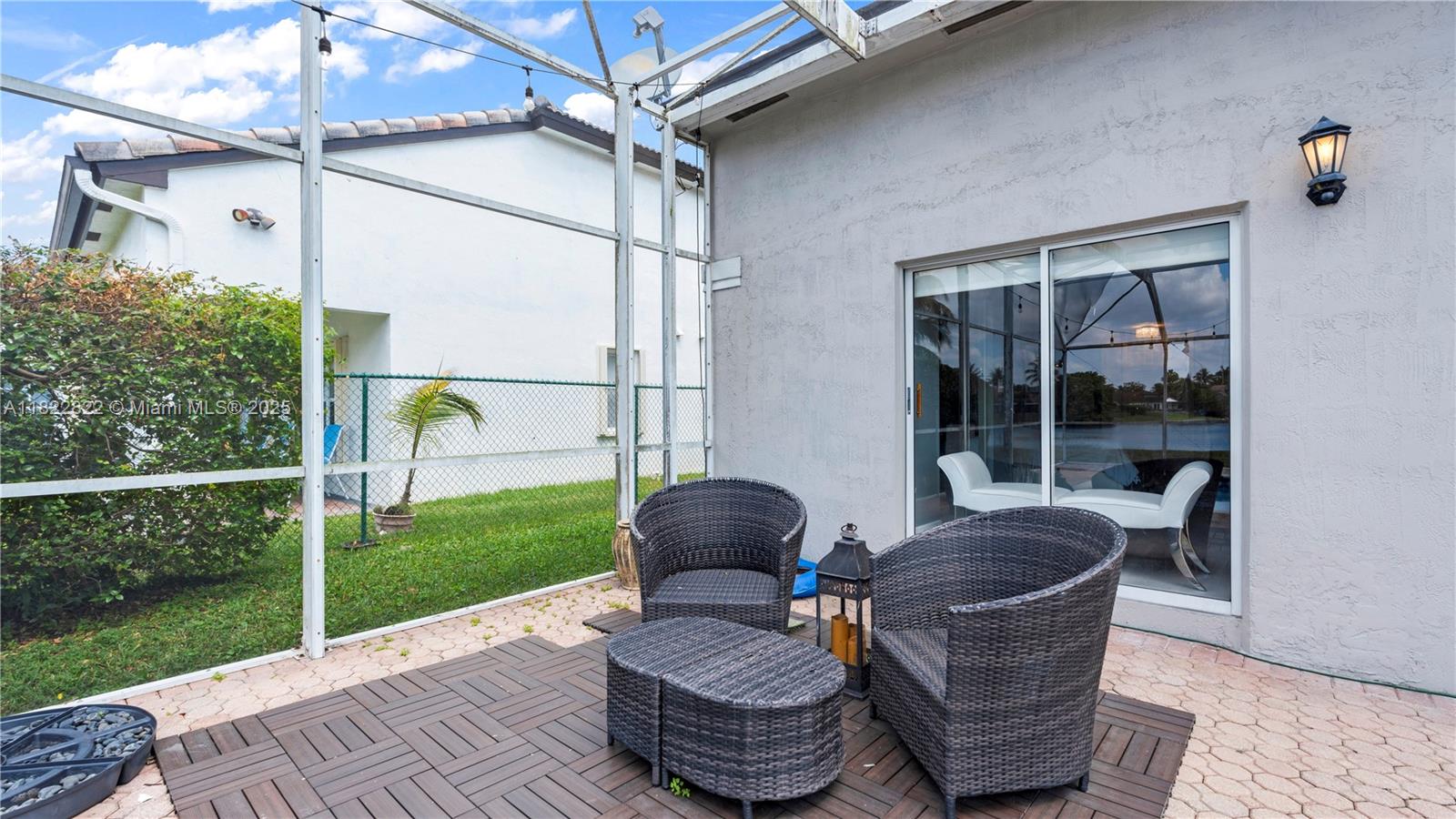 8356 Southwest 158th Avenue Miami, FL 33193 - Photo 42 of 48 a living room with a couch and a garden view