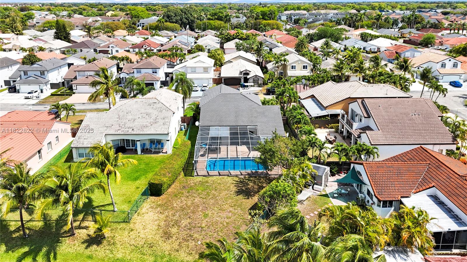8356 Southwest 158th Avenue Miami, FL 33193 - Photo 44 of 48 an aerial view of multiple houses with a yard