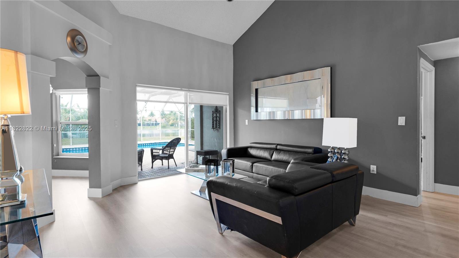 8356 Southwest 158th Avenue Miami, FL 33193 - Photo 6 of 48 a living room with furniture and a flat screen tv