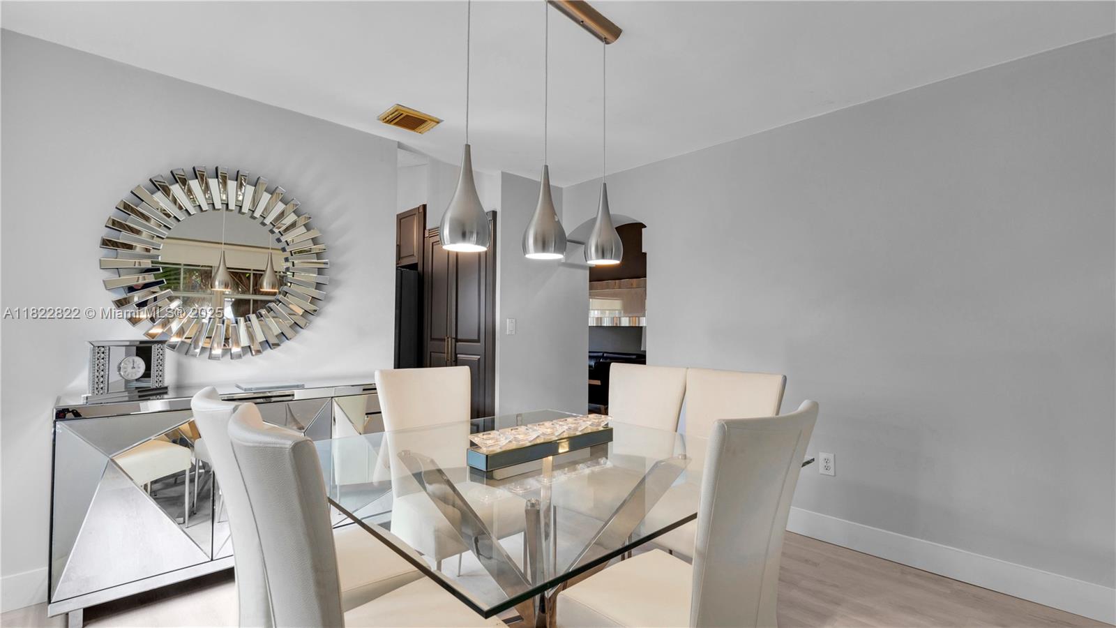 8356 Southwest 158th Avenue Miami, FL 33193 - Photo 9 of 48 a view of a dining room with furniture and wooden floor