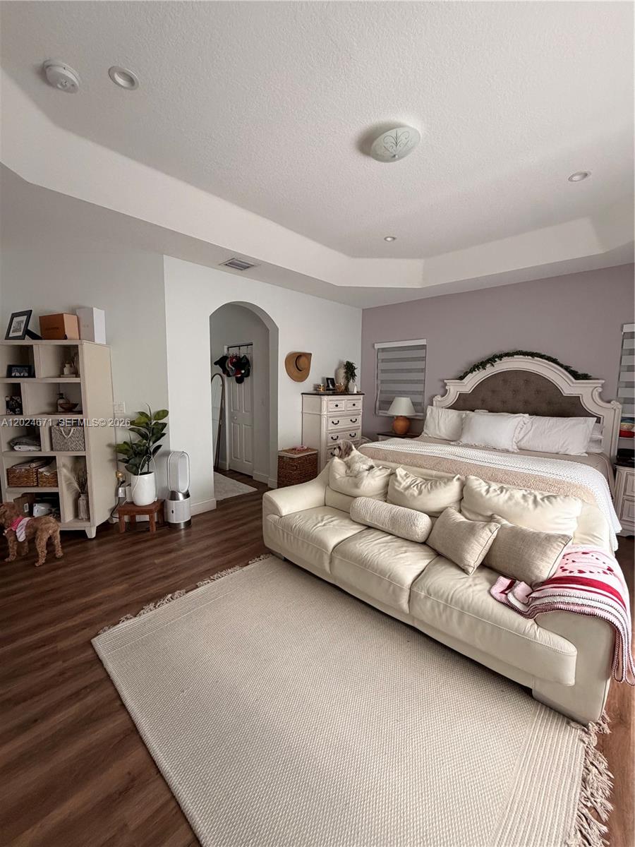 2116 Northeast 38th Road, Unit 2116 Homestead, FL 33033 - Photo 15 of 31 a bedroom with a bed and a couch