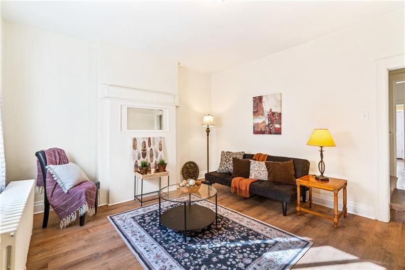23 Edith Place Pittsburgh, PA 15213 - Photo 2 of 23 a living room with furniture and a lamp