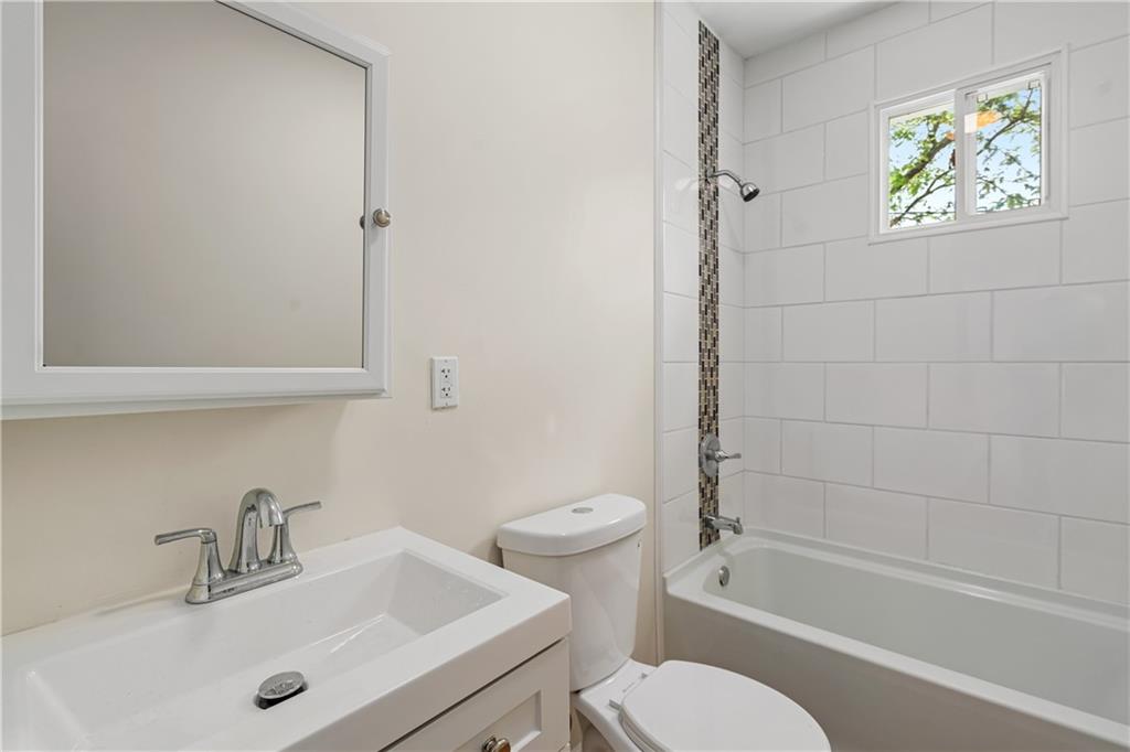 23 Edith Place Pittsburgh, PA 15213 - Photo 10 of 23 a bathroom with a sink mirror vanity and toilet
