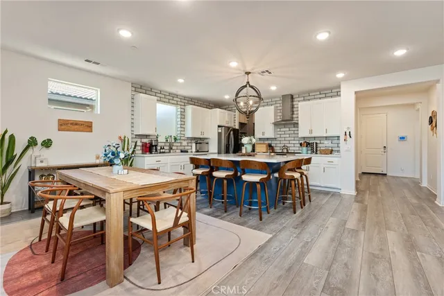 a kitchen with stainless steel appliances a sink and a cabinets