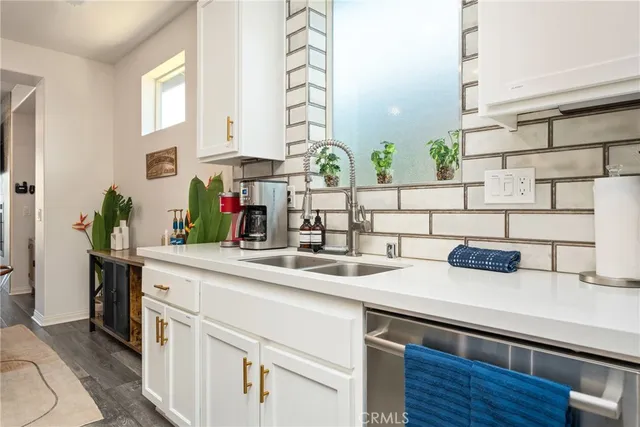 a kitchen with stainless steel appliances granite countertop a kitchen island a stove a table and chairs in it