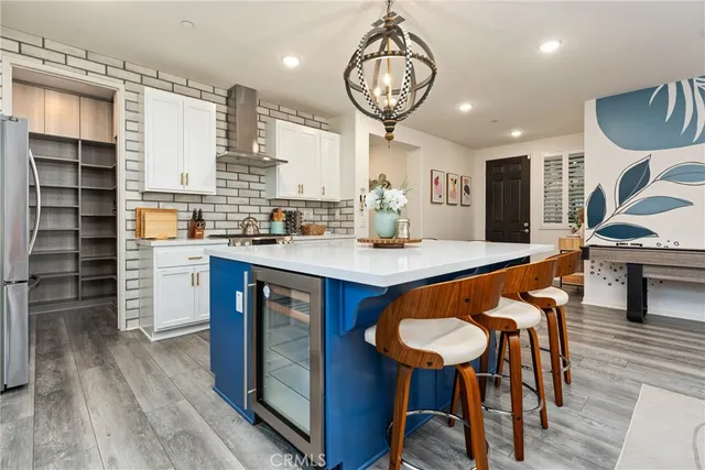 a view of a dining room with furniture and a potted plant