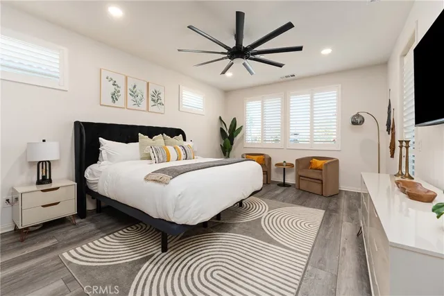 a spacious bathroom with a double vanity sink and a mirror