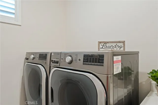 a lamp on a table and chair in a room