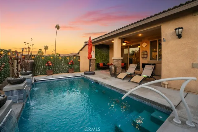 a view of a patio with a table and chairs