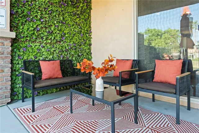 a house view with a sitting space and garden space