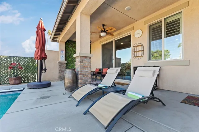 a view of a swimming pool with a patio